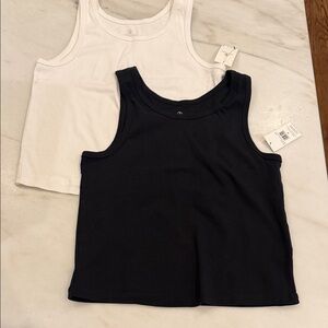 VOLCOM NWT black and white tank tops. Price for both.